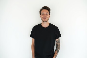 Fototapeta premium Half-Length (Waist-Up) portrait of young stylish smiling Liechtensteiner male model in goth wear isolated on pure white background looking at camera