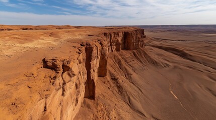 Naklejka premium Impressive rock formations in a vast desert landscape under a bright blue sky with wispy clouds : Generative AI