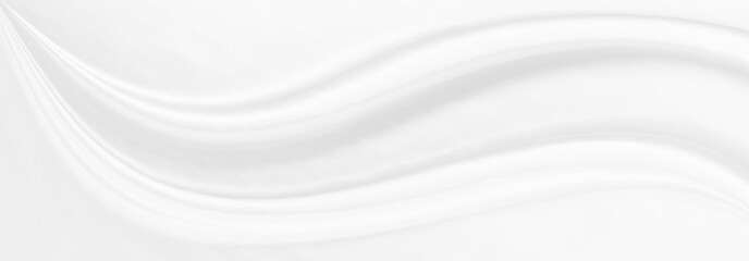 White gray satin texture that is white silver fabric silk panorama background with beautiful soft blur pattern natural.