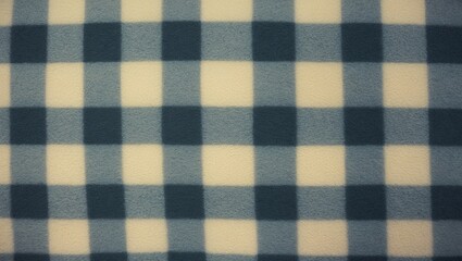 Fleece texture backdrop featuring a plaid pattern. Gray fleece material texture with a checkered design.