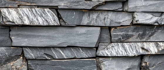 Textured Slate Stone Wall in Varying Shades of Gray and Black for Interior or Exterior Design Projects
