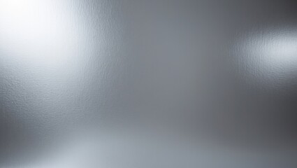 Fototapeta premium Glowing silver foil paper surface with empty space, abstract textured background.
