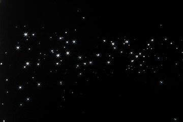 Shining water created sparkling splash with bright reflections and starburst flare, like  star in...