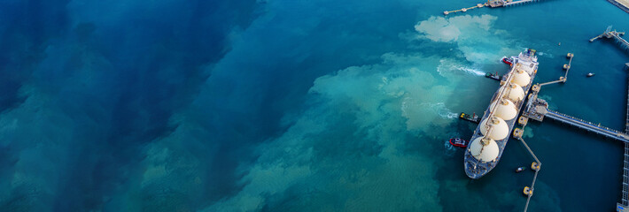 LNG (Liquified Natural Gas) tanker anchored in Gas terminal gas tanks for storage. Oil Crude Gas...