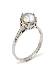 A silver ring with a white stone in the center