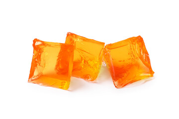 Tasty orange jelly cubes isolated on white, top view