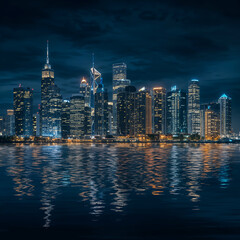 Obraz premium Serene Night Cityscape with Illuminated Skyscrapers and Reflection