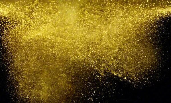 A luxurious backdrop of shimmering gold dust swirling gently against a soft black background, elegant and mesmerizing