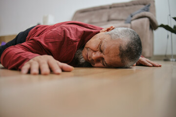 Asian Senior Grandfather Fainting And Falling On The Ground In The Living Room