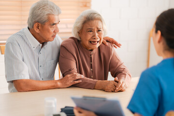 Caregiver Consoling an Elderly Retired Patient, Offering Support and Health Care to Senior Dealing with Disease and Depression, Providing Comfort and Assistance During a Sad and Difficult Time
