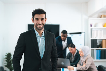 Portrait of Confident Male Businessman, Professional Executive in Suit, Smiling and Looking Towards Success, Capturing the Essence of Corporate Life and Entrepreneurship in an Office Setting