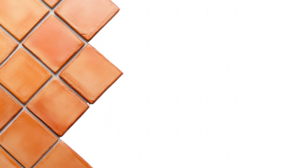a corner of square ceramic tiles in warm orange tones arranged diagonally against a white background suggesting a design or renovation context