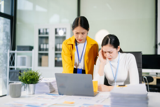 A stressed business team in shock after financial failure. Upset colleagues brainstorm solutions, reacting to bad news