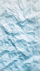 Obraz premium Abstract textured background. A pale blue and white crumpled paper surface with many creases and folds.