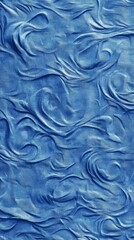 Fototapeta premium Abstract blue texture featuring sculpted waves, creating a fluid, dynamic effect on a textured surface.