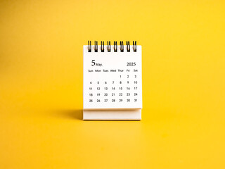 Front view of May, 2025 desk calendar for organizer to plan and reminder standing, isolated on...