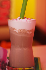 Delicious chocolate beverage topped with whipped cream and sprinkles