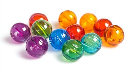 Colorful translucent beads scattered on white background.