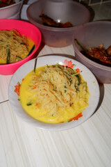 There's delicious food on the table: fish, vegetables, and rice