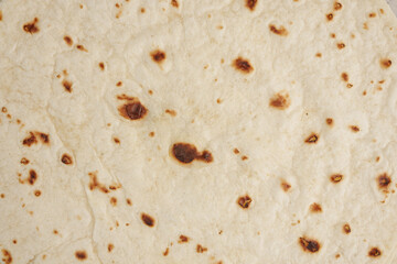 Homemade capati freshly cooked on a hot surface for meals