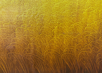 Close up of colorful gradient in yellow, gold, and brown color. With random arches and curves...