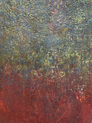 Close up weathered wall background in corroded grey and red paint color. Oxidized wall panel in grunge and dirt texture. Grey and red paint. Seamless background texture.
