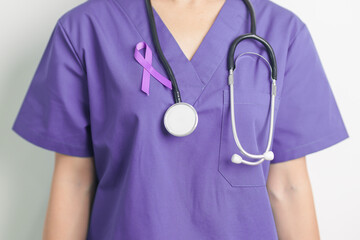 Doctor holding purple Ribbon for Violence, Pancreatic, Esophageal, Testicular cancer, Alzheimer,...