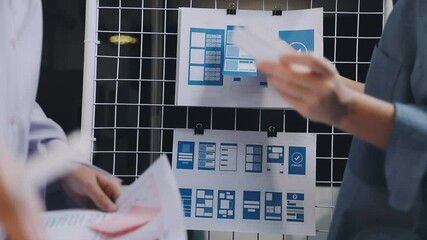 Website designer, Creative planning phone app development template layout framework wireframe design, User experience concept, Young asian woman UX designer working on smartphone application at office