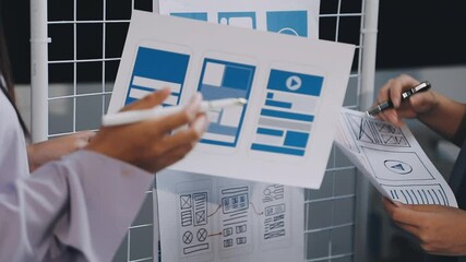 Website designer, Creative planning phone app development template layout framework wireframe design, User experience concept, Young asian woman UX designer working on smartphone application at office