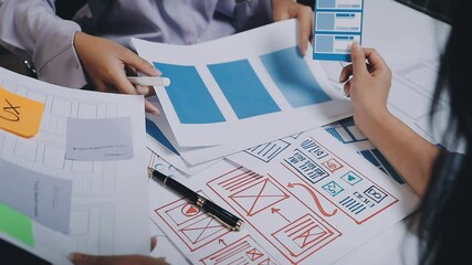 Website designer, Creative planning phone app development template layout framework wireframe design, User experience concept, Young asian woman UX designer working on smartphone application at office