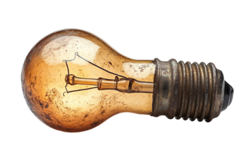 Old vintage light bulb with a tarnished metal base on a white isolated background.