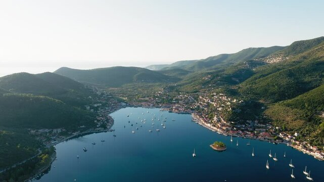 Slow panning drone shot of Vathy village in Ithaca island during sunrise, Ionian sea, Greece