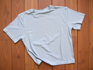 Light Gray T-Shirt on Wooden Background