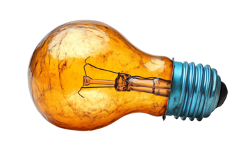 Vintage light bulb with an amber hue on a white background, capturing an elegant and nostalgic aesthetic.