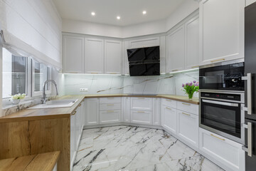Modern White Kitchen with Wooden Accents