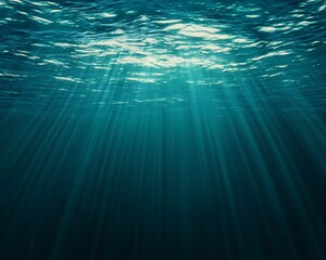 Obraz premium An underwater scene with sunlight beaming through the ocean waves