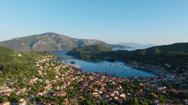 Aerial panoramic view of picturesque Vathy village in Ithaca island during sunrise, Ionian sea, Greece