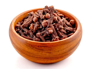 cloves in a light wooden bowl isolated on white background