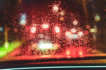 Colorful Bokeh Lights through Rainy Car Window