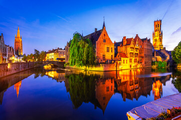 Bruges, Belgium: Night view of the Dijver river canal and Belfortower Belfry from Rozenhoedkaai