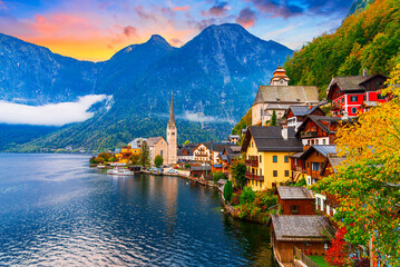 Hallstatt, Austria, Salzkammergut region: Misty autumn scenic morning view of Hallstatter See or Lake Hallstatt and the old town church in world famous alpine village in Upper Austria, Europe