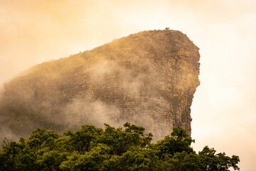 Dramatic mist-covered mountain peak.