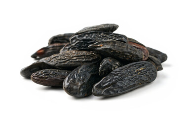 closeup pile of tonka bean isolated on white background