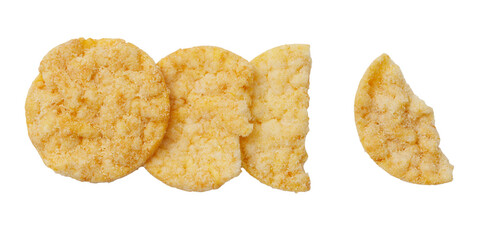 A close up of a few pieces of a snack food, one of which has been bitten into