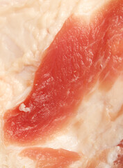 A close up of a piece of meat with a red spot on it