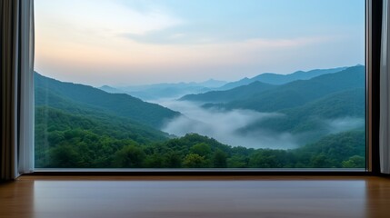 Serene mountain view from a modern window at sunrise with mist rising over lush green valleys