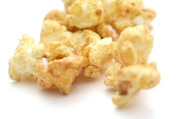 Popcorn heap,Close-up of popcorn against white background - stock photo

