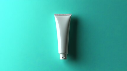 An isolated white tube lies on a bright teal background