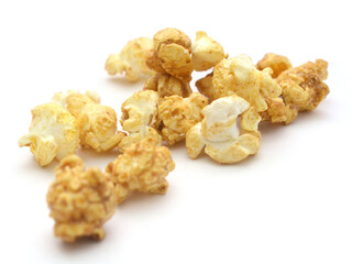 Popcorn heap,Close-up of popcorn against white background - stock photo

