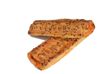 Two puff pastry buns with filling lie on a white background.